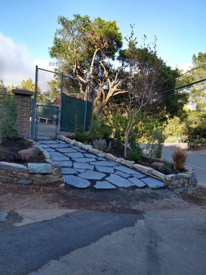 Flagstone pathway construction for residential yard improvement